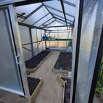 Inside the greenhouse built from repurposed materials