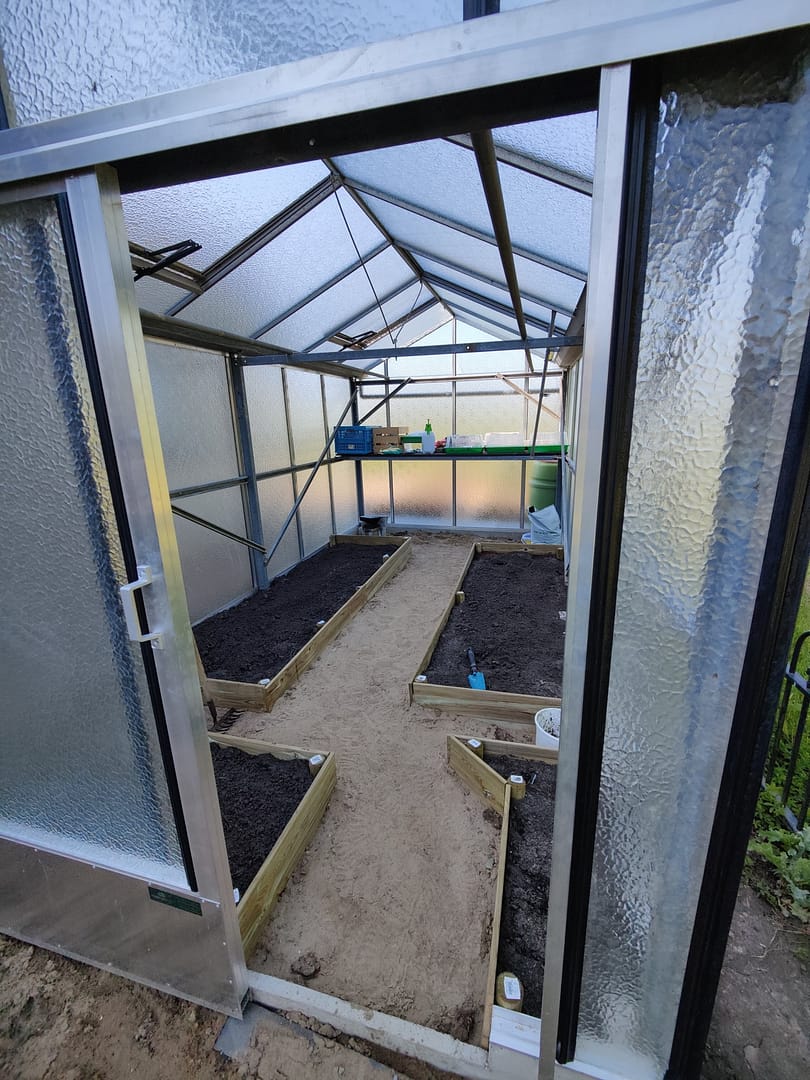 Inside the greenhouse built from repurposed materials